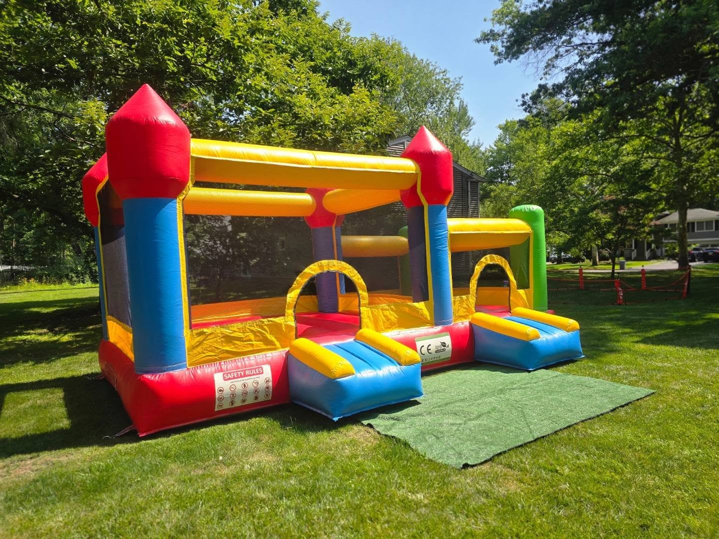 Mommy Bounce World's colorful two-in-one bounce house set up outdoors